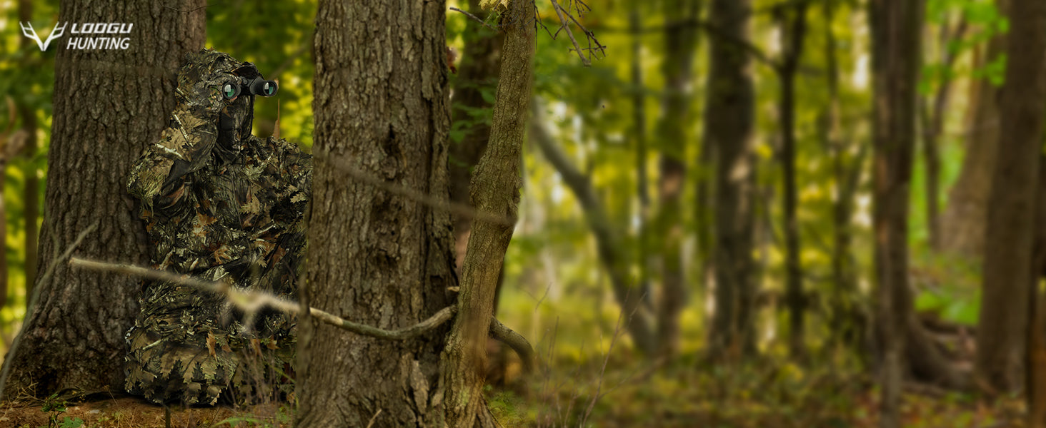 Observer wearing leafy camouflage with binoculars