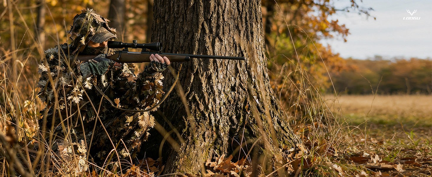 Hunter wearing LOOGU leafy camouflage in woodland