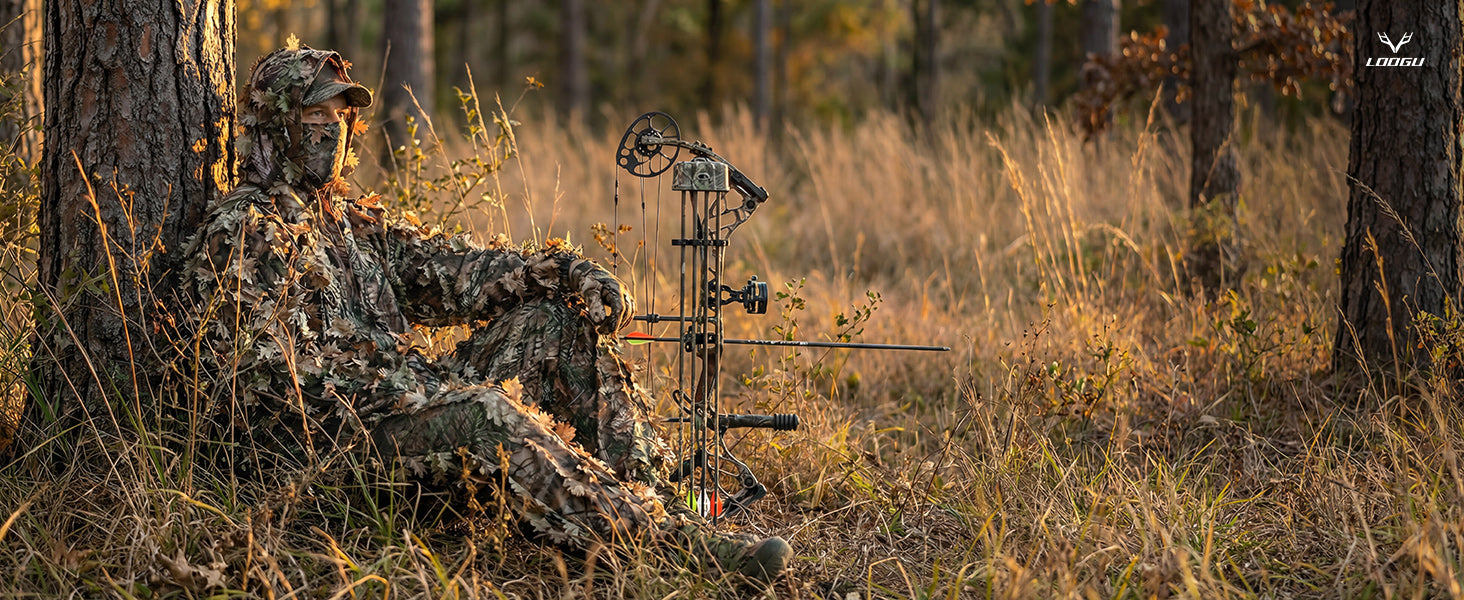 Hunter seated in warm dry woodland